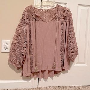 Beautiful mauve blouse with intricate details.